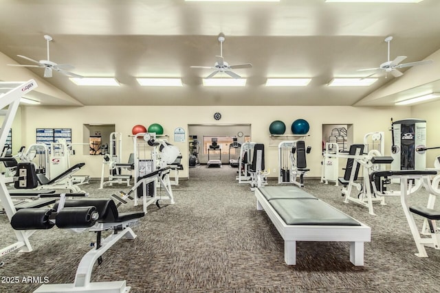 exercise room featuring lofted ceiling, carpet floors, and a ceiling fan