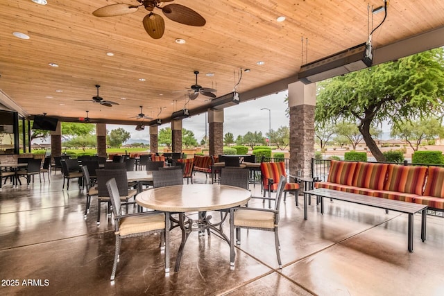 view of patio featuring outdoor dining area and ceiling fan