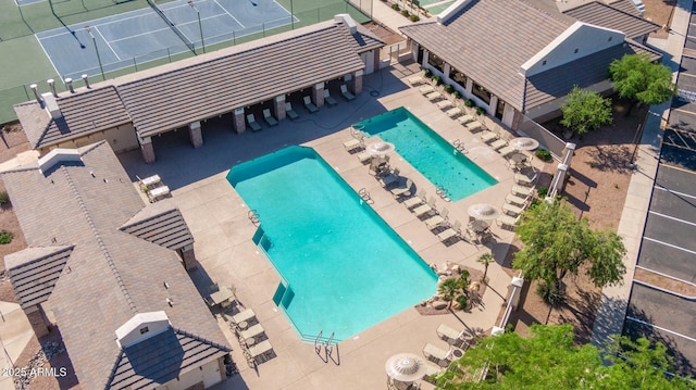 pool featuring a patio and fence