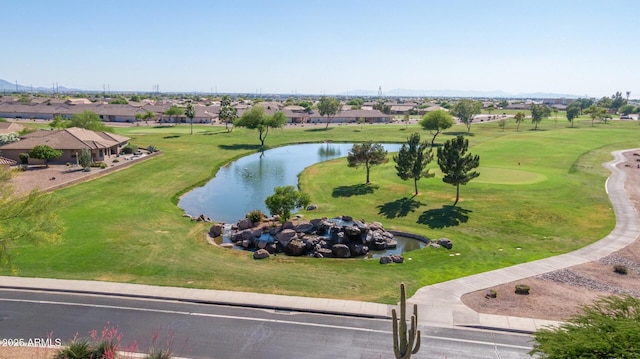 drone / aerial view featuring a water view and a residential view