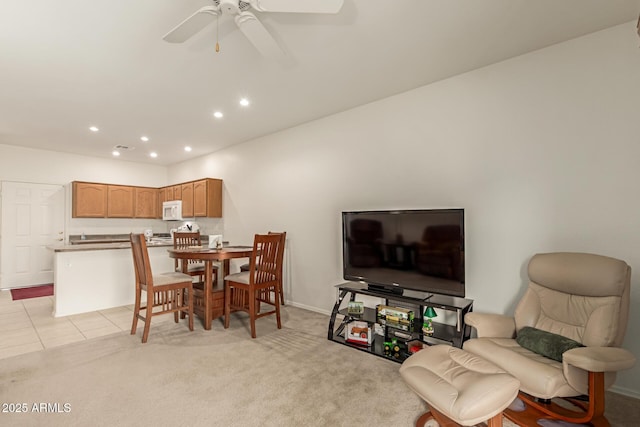 dining area with ceiling fan, recessed lighting, light tile patterned flooring, and light colored carpet