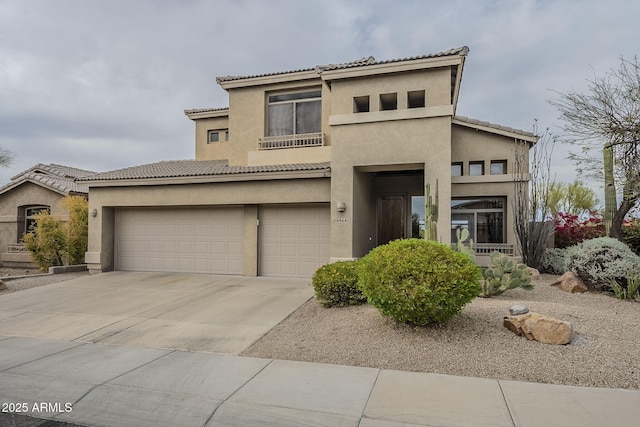 4864 E Eden Dr, Cave Creek, AZ 85331 - view of front of house with a tile roof, concrete driveway, stucco siding, and an attached garage