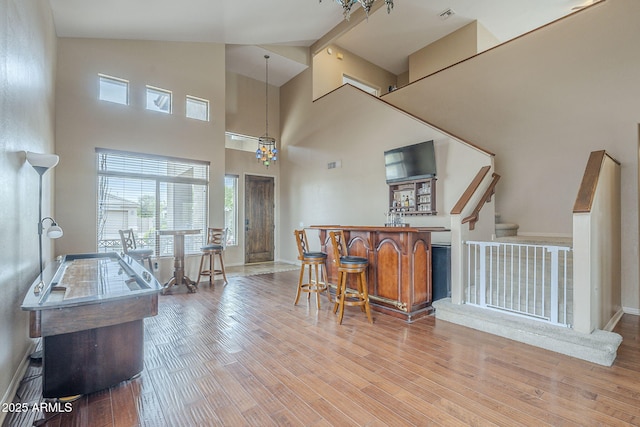 4864 E Eden Dr, Cave Creek, AZ 85331 - kitchen with baseboards, visible vents, high vaulted ceiling, and wood finished floors