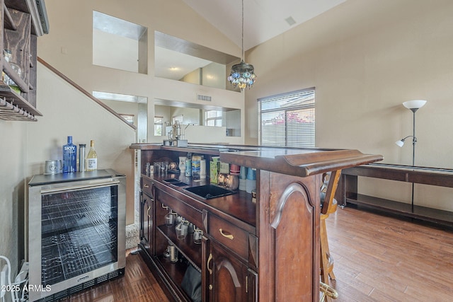 4864 E Eden Dr, Cave Creek, AZ 85331 - interior details featuring beverage cooler, visible vents, wood finished floors, and a dry bar