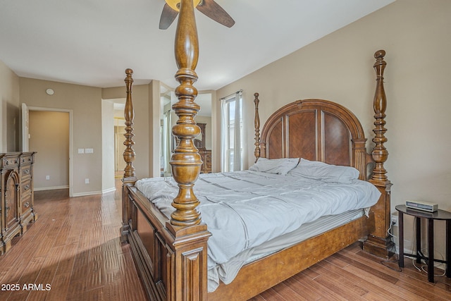 4864 E Eden Dr, Cave Creek, AZ 85331 - bedroom featuring baseboards, wood finished floors, and a ceiling fan