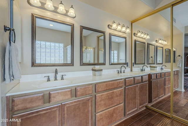 4864 E Eden Dr, Cave Creek, AZ 85331 - bathroom featuring double vanity, wood finished floors, and a sink