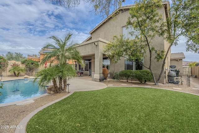 4864 E Eden Dr, Cave Creek, AZ 85331 - back of property featuring fence, a patio, a fenced in pool, a lawn, and stucco siding