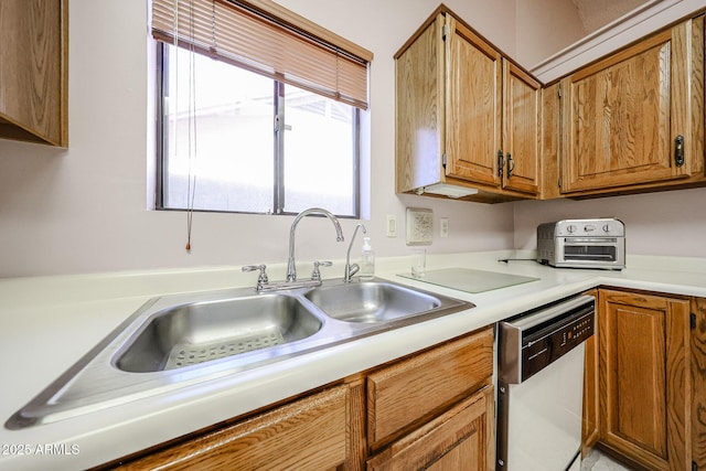 kitchen with a sink, brown cabinets, dishwasher, and light countertops