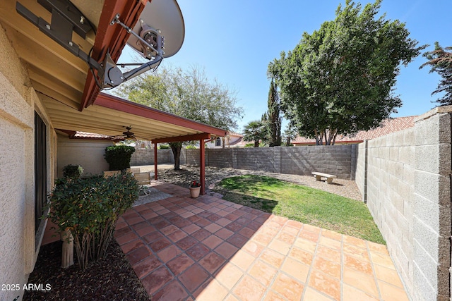 view of patio / terrace with a ceiling fan and a fenced backyard