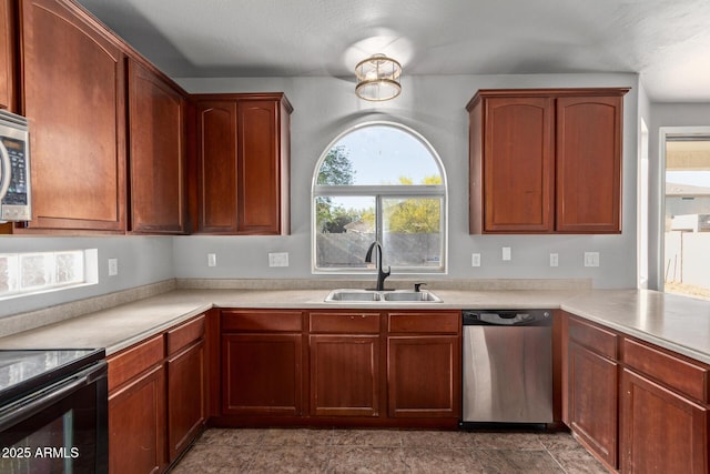 kitchen featuring stainless steel dishwasher, black / electric stove, light countertops, and a sink