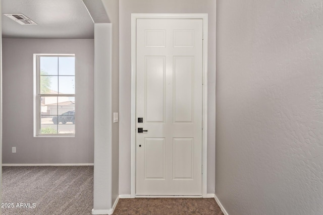 entryway featuring visible vents, baseboards, and plenty of natural light