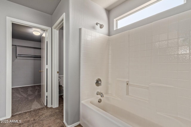 bathroom featuring toilet and tub / shower combination