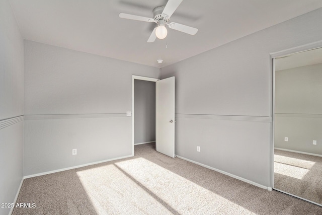 unfurnished bedroom with baseboards and carpet flooring