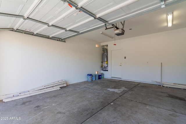 garage with gas water heater and a garage door opener