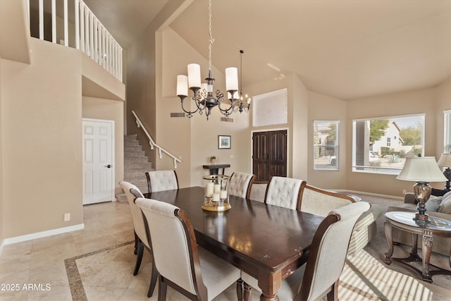 dining space with high vaulted ceiling, a notable chandelier, visible vents, baseboards, and stairs