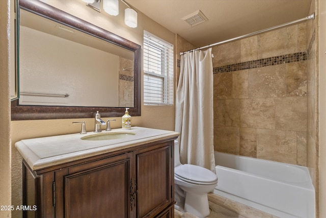 full bathroom featuring toilet, shower / bath combo, vanity, and visible vents