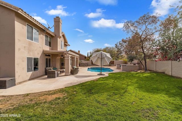 view of yard featuring a fenced in pool, a ceiling fan, a fenced backyard, a patio area, and outdoor lounge area