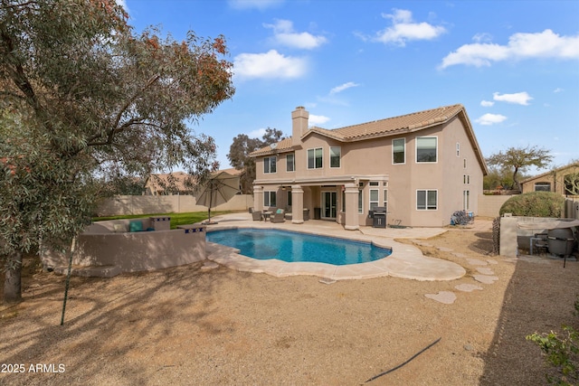 view of pool featuring a fenced in pool, a fenced backyard, and a patio