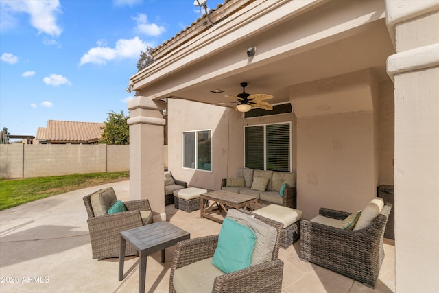 view of patio / terrace featuring fence, an outdoor hangout area, and ceiling fan