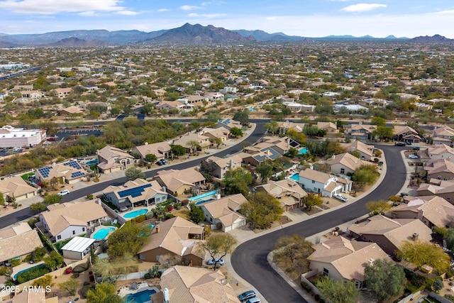 birds eye view of property with a residential view and a mountain view