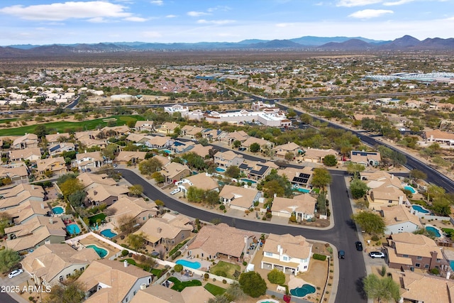 aerial view with a mountain view and a residential view