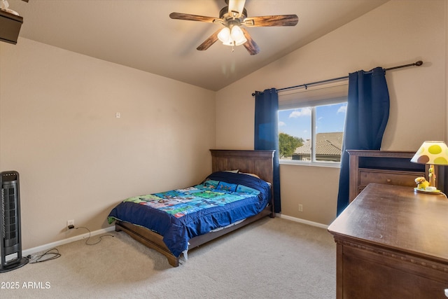 carpeted bedroom with baseboards, vaulted ceiling, and a ceiling fan