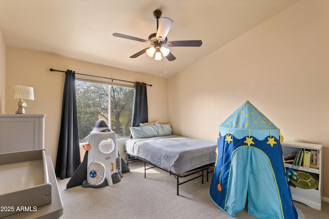 carpeted bedroom with lofted ceiling and a ceiling fan