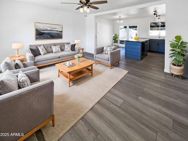 living room with ceiling fan and dark hardwood / wood-style floors