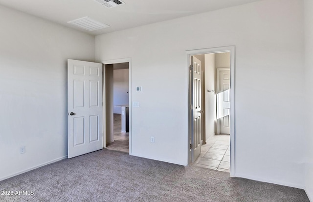 unfurnished bedroom with light colored carpet