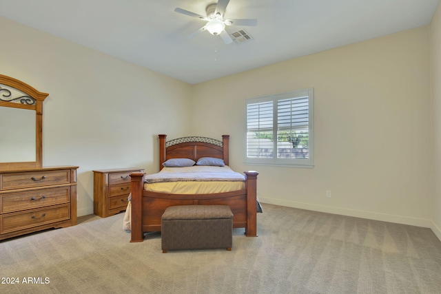 bedroom with light carpet and ceiling fan