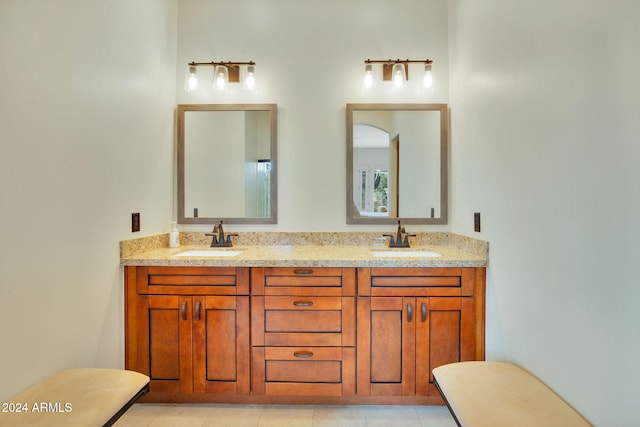 bathroom with tile patterned flooring and vanity