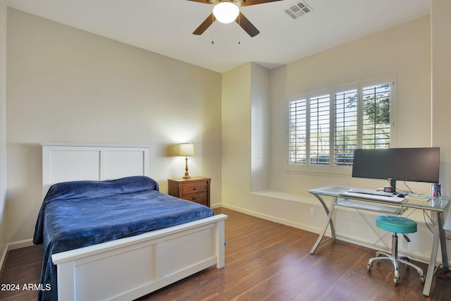 bedroom featuring ceiling fan and dark hardwood / wood-style flooring