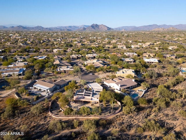 birds eye view of property featuring a mountain view