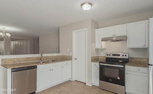 kitchen featuring light tile patterned flooring, stainless steel appliances, sink, and white cabinets