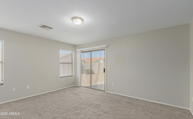 unfurnished room featuring carpet floors