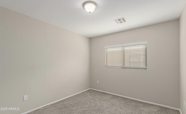 unfurnished room with light carpet