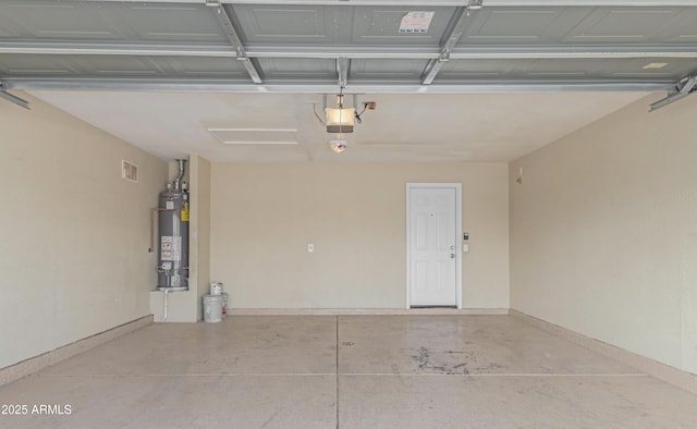 garage featuring a garage door opener and water heater