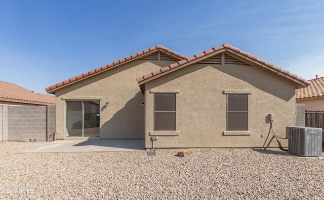 rear view of house featuring a patio area and central air condition unit