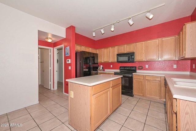 kitchen with black appliances, light tile patterned floors, sink, and a center island