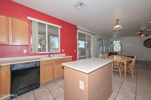 kitchen with light tile patterned floors, dishwasher, a center island, and sink