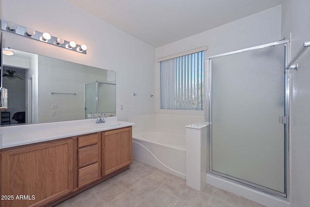 bathroom with ceiling fan, vanity, and independent shower and bath