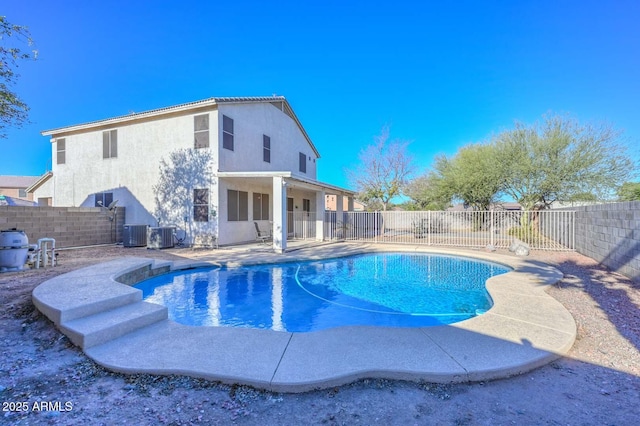 view of pool featuring a patio area and central air condition unit