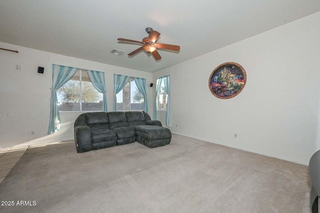 carpeted living room featuring ceiling fan