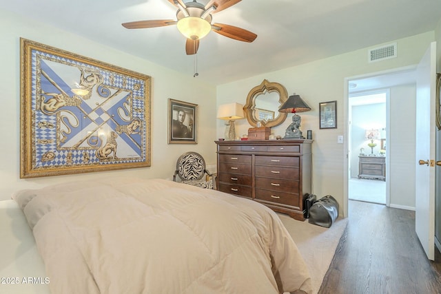 bedroom featuring visible vents, baseboards, and a ceiling fan