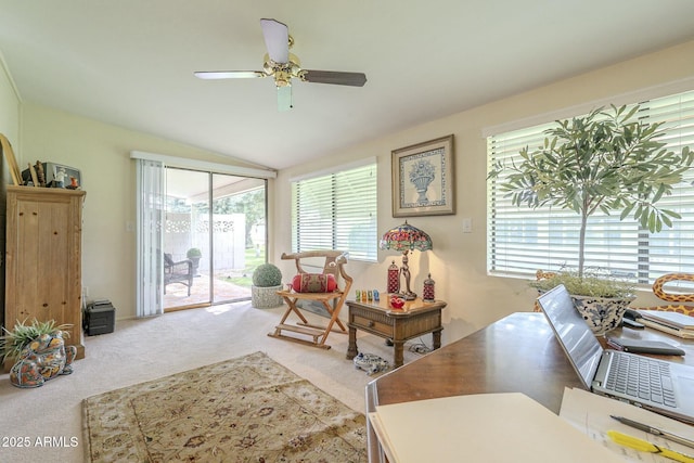 living area featuring vaulted ceiling, carpet floors, and ceiling fan