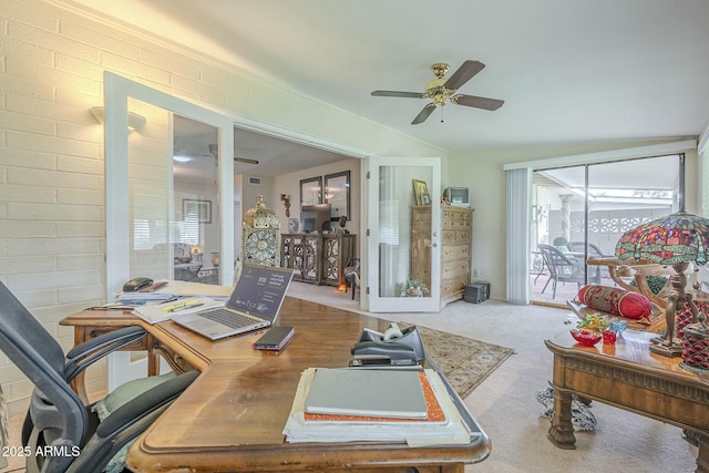 office with brick wall, a ceiling fan, and carpet floors