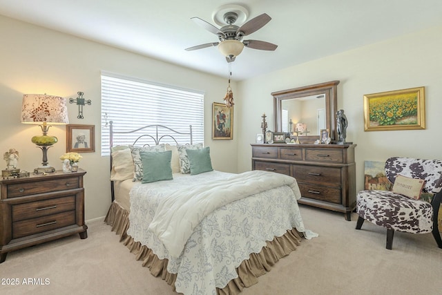 bedroom with light colored carpet and ceiling fan