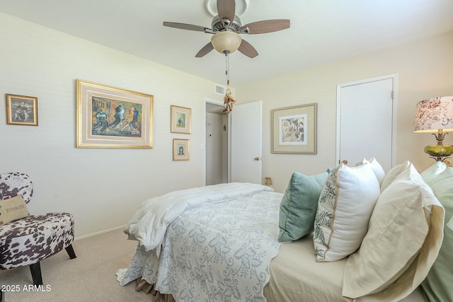 carpeted bedroom featuring a ceiling fan, baseboards, and visible vents