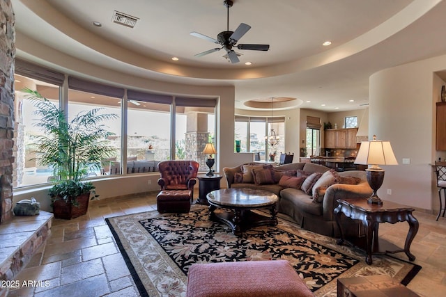 35195 N 98th St Unit 85, Scottsdale, AZ 85262 - living area with stone tile flooring, recessed lighting, a ceiling fan, and a raised ceiling