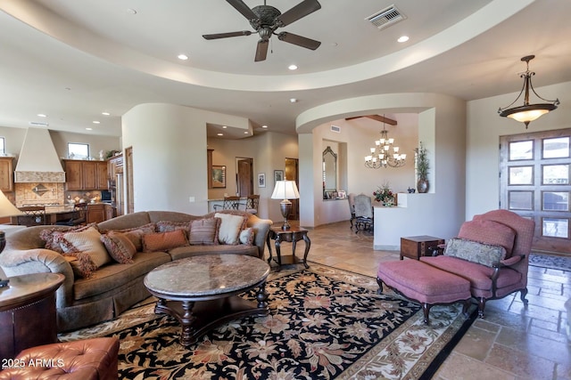 35195 N 98th St Unit 85, Scottsdale, AZ 85262 - living area with recessed lighting, a ceiling fan, stone tile flooring, arched walkways, and a chandelier